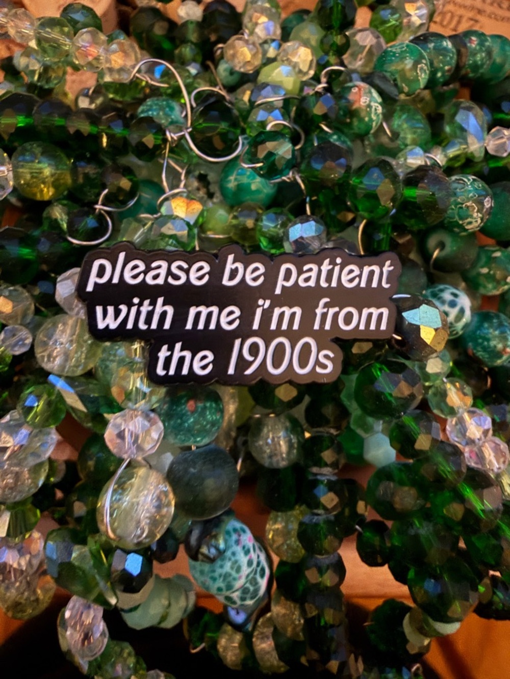 Enamel pin with 'please be patient with me i'm from the 1900s'